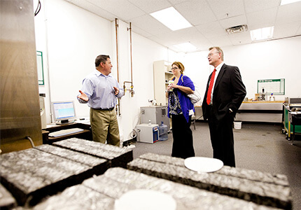 visitors touring CAIT asphalt pavement lab