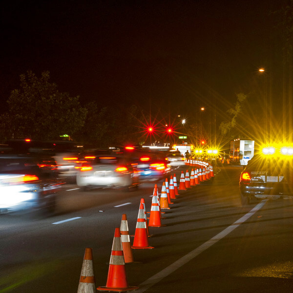 nighttime work zone with police and traffic