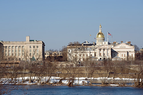 photo of New Jersey Statehouse in Trenton from across the river