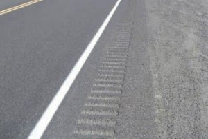 close up of pavement with shoulder rumble strips