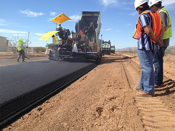 road crew laying new pavement