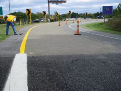 Roadway being paved with High Friction Surface Treatment