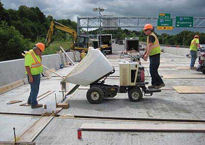 Construction workers on I-81 connecting bridge panels