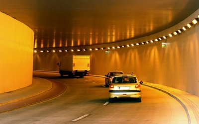 Row of vehicles moving through the tunnel